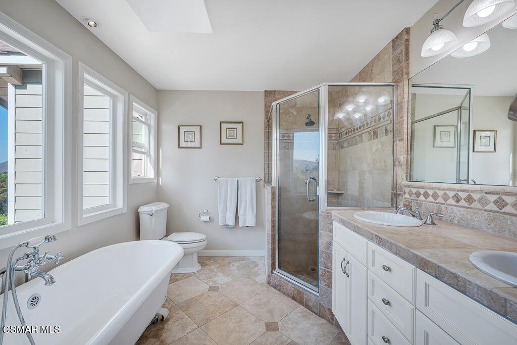 11780 Barranca Road Camarillo, CA 93012 - Photo 10 of 26 a spacious bathroom with a tub sink shower and mirror