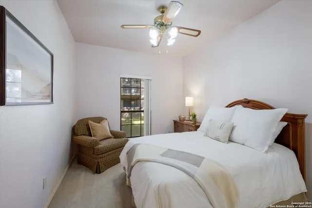 a bedroom with bed and window