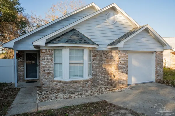 a front view of a house with parking