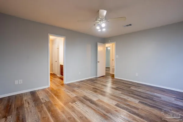 a bathroom with a toilet and a bathtub