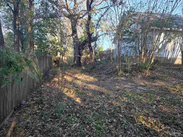 a view of a house with pool and windows