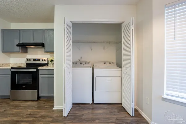 a kitchen with a stove and a refrigerator