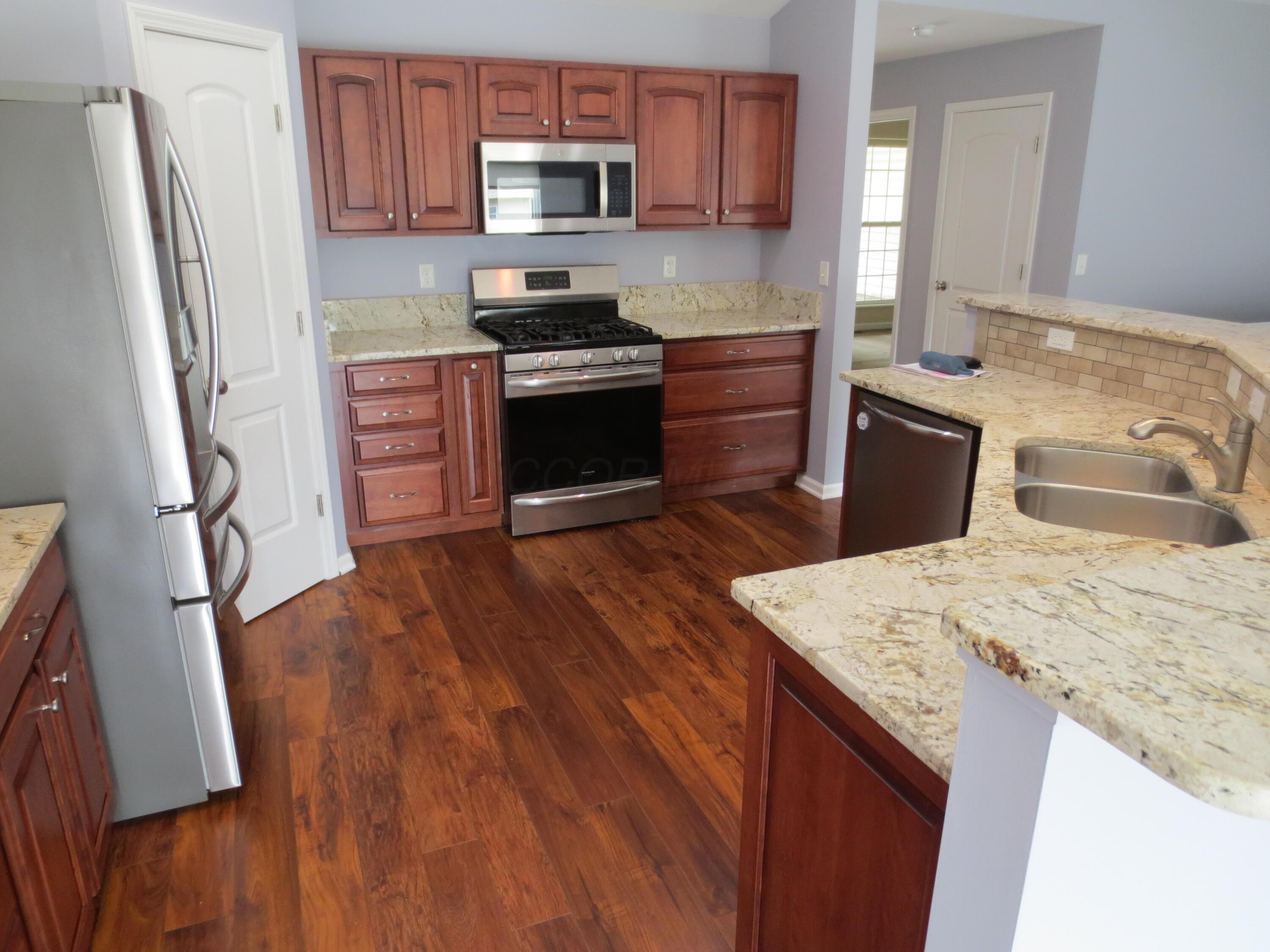 101 Merriston Circle Delaware, OH 43015 - Photo 5 of 34 Kitchen with refaced cabinets and slow closing drawers. Granite counter tops. Stainless appliances