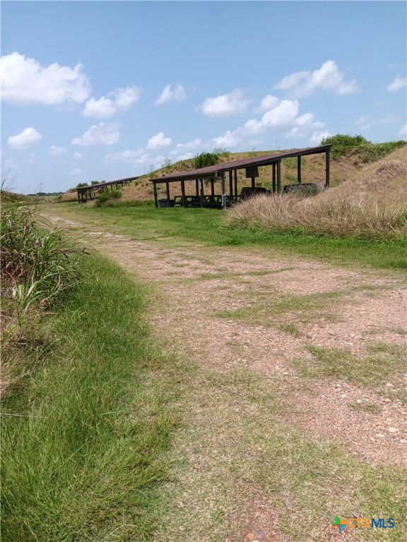 490 Adcock Ranch Road Victoria, TX 77904 - Photo 3 of 10 a view of building with ocean view