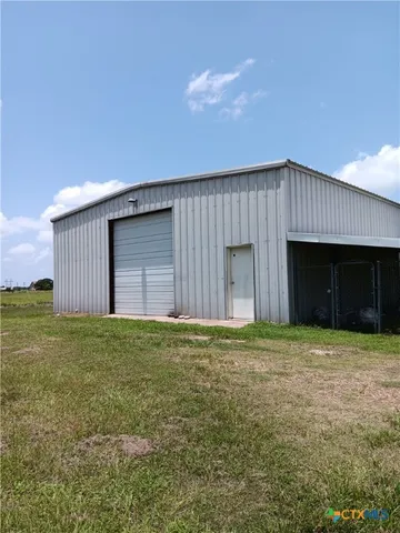 a house with yard in front of it