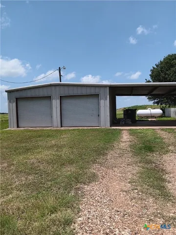 a front view of a house with yard