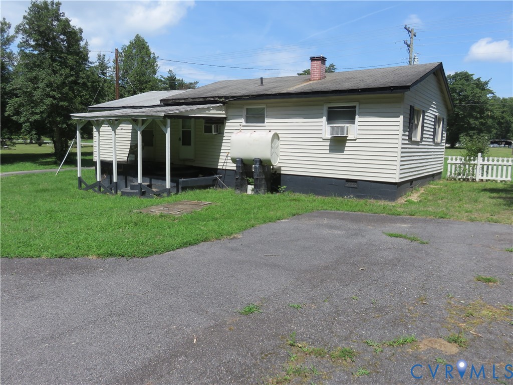 11965 River Road Chesterfield, VA 23838 - Photo 11 of 29 a view of a white house with a yard and potted plants