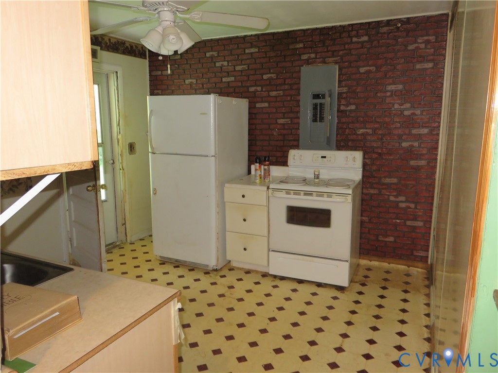 11965 River Road Chesterfield, VA 23838 - Photo 15 of 29 a bathroom with a sink and a refrigerator