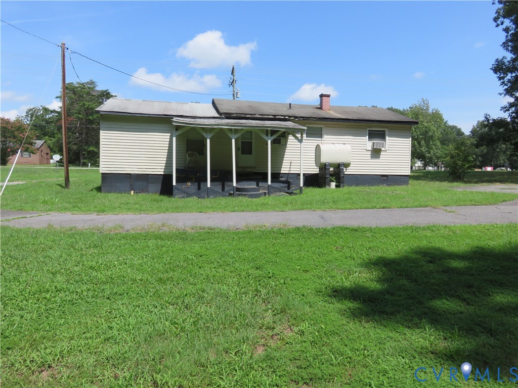 11965 River Road Chesterfield, VA 23838 - Photo 9 of 29 a front view of a house with a yard and garage