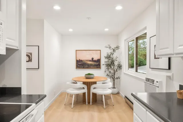 a dining room with furniture and window