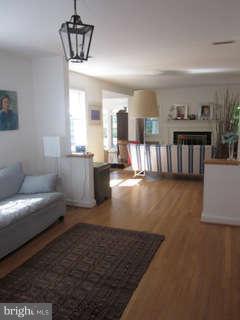 7403 Denton Road Bethesda, MD 20814 - Photo 13 of 25 a living room with furniture and a wooden floor