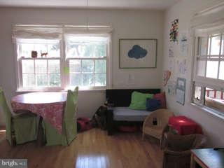 7403 Denton Road Bethesda, MD 20814 - Photo 15 of 25 a living room with furniture a window and wooden floor