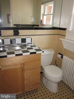 7403 Denton Road Bethesda, MD 20814 - Photo 20 of 25 a bathroom with a toilet and a sink