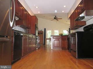 7403 Denton Road Bethesda, MD 20814 - Photo 3 of 25 a view of a hallway with a refrigerator
