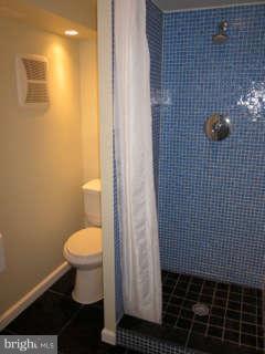 7403 Denton Road Bethesda, MD 20814 - Photo 23 of 25 a bathroom with a toilet and a sink