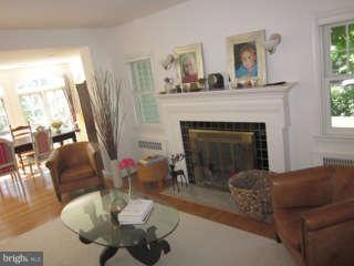 7403 Denton Road Bethesda, MD 20814 - Photo 10 of 25 a living room with furniture and a fireplace