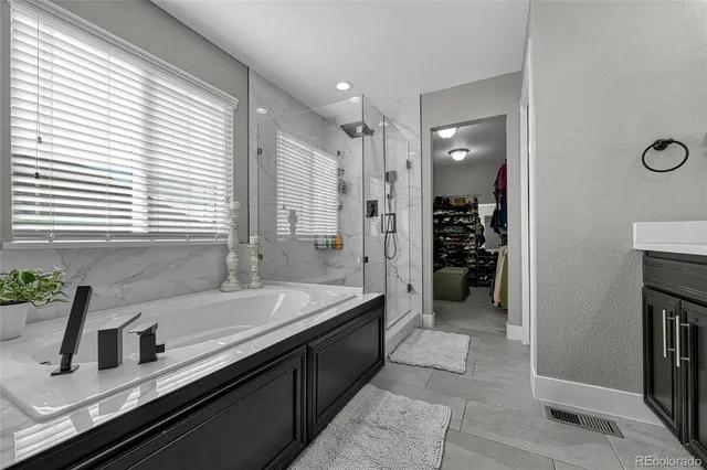 a bathroom with a bathtub and a sink