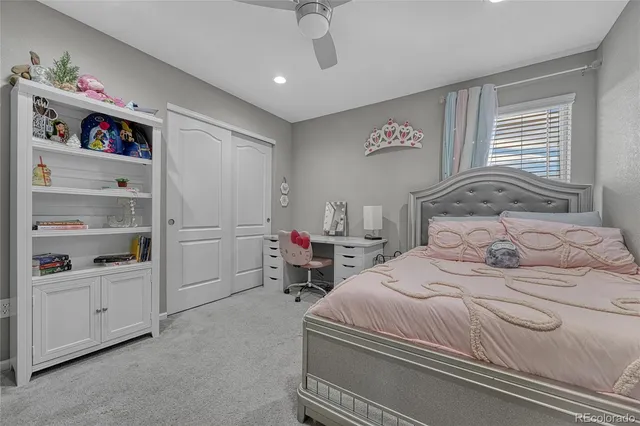 a bedroom with a bed and closet