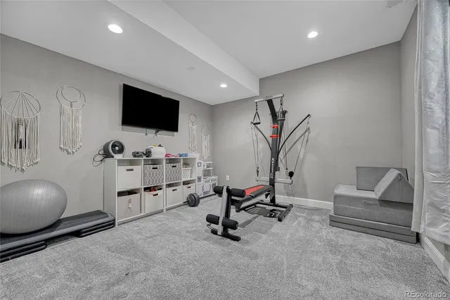 a view of a livingroom with workspace and a couch