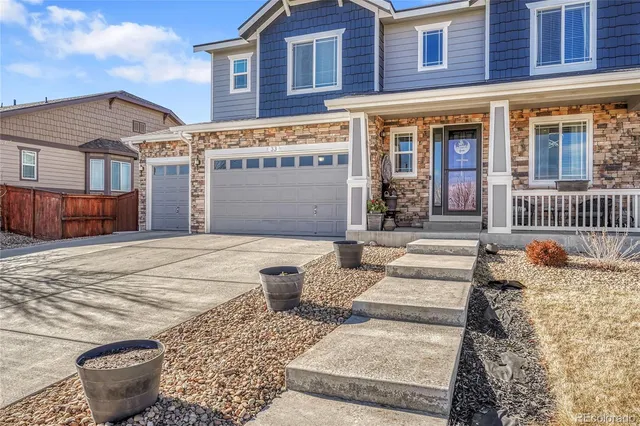 a front view of a building with outdoor seating