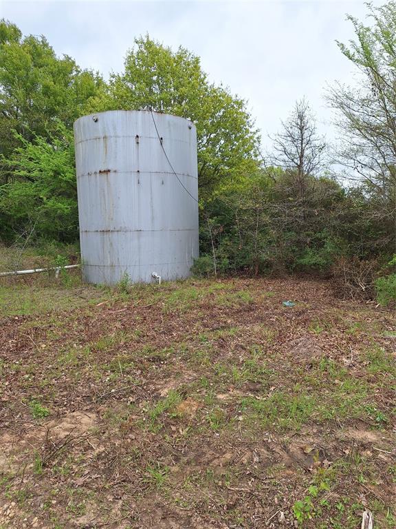 3371 Fm-3371 Path Groesbeck, TX 76642 - Photo 8 of 19 a view of a barn in the middle of a yard