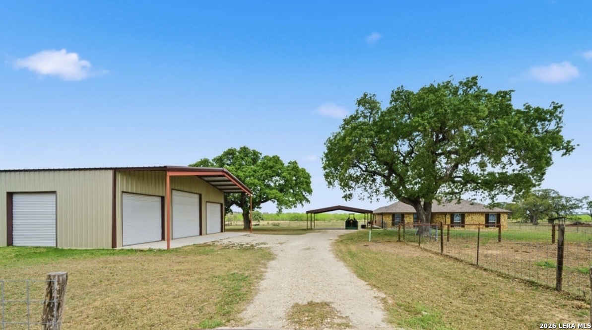12897 La Vernia Road St. Hedwig, TX 78152 - Photo 5 of 34 a house view with a garden space