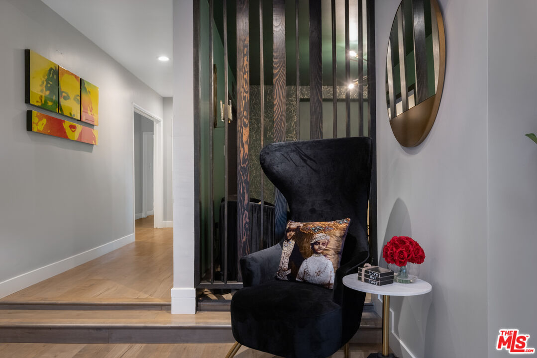 9476 Hidden Valley Place Beverly Hills, CA 90210 - Photo 13 of 43 a picture of a room with wooden floor and windows