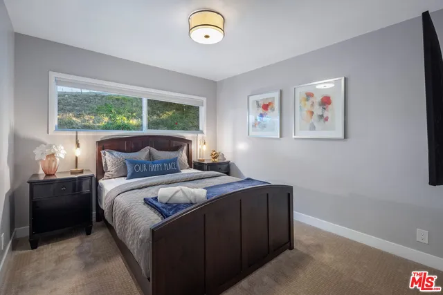 a kitchen with stainless steel appliances granite countertop a refrigerator and a stove