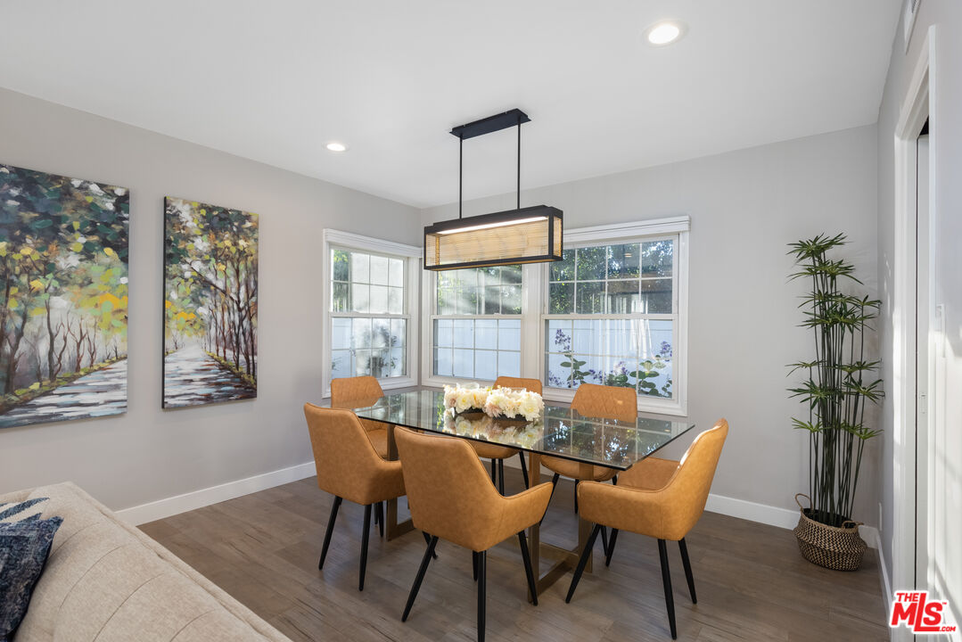 9476 Hidden Valley Place Beverly Hills, CA 90210 - Photo 2 of 43 a dining room with furniture and wooden floor