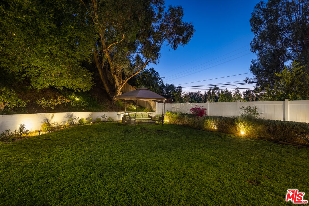 9476 Hidden Valley Place Beverly Hills, CA 90210 - Photo 26 of 43 a view of yard with swimming pool and green space