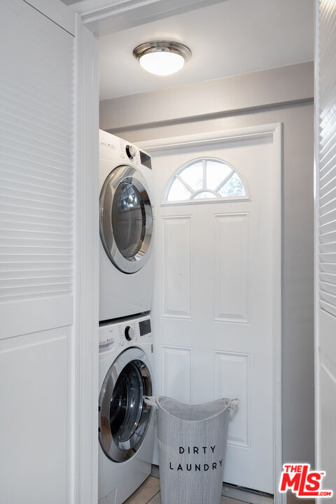 9476 Hidden Valley Place Beverly Hills, CA 90210 - Photo 27 of 43 a utility room with dryer and washer