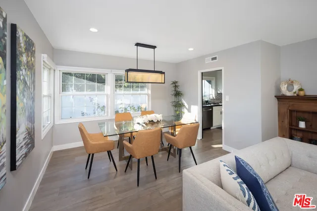 a bedroom with a large bed and a large window