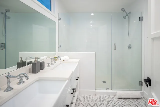 a view of a backyard with plants and a patio