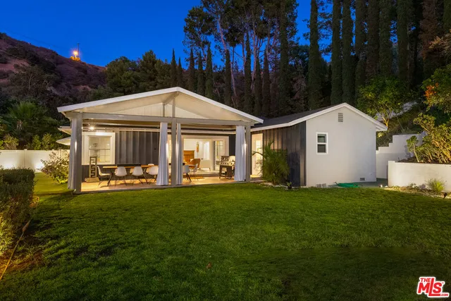 a view of an outdoor sitting area with swimming pool