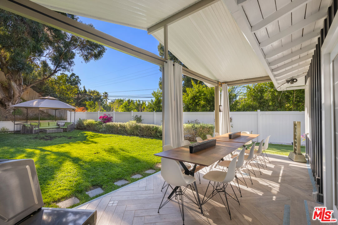 9476 Hidden Valley Place Beverly Hills, CA 90210 - Photo 38 of 43 a view of an outdoor sitting area with swimming pool