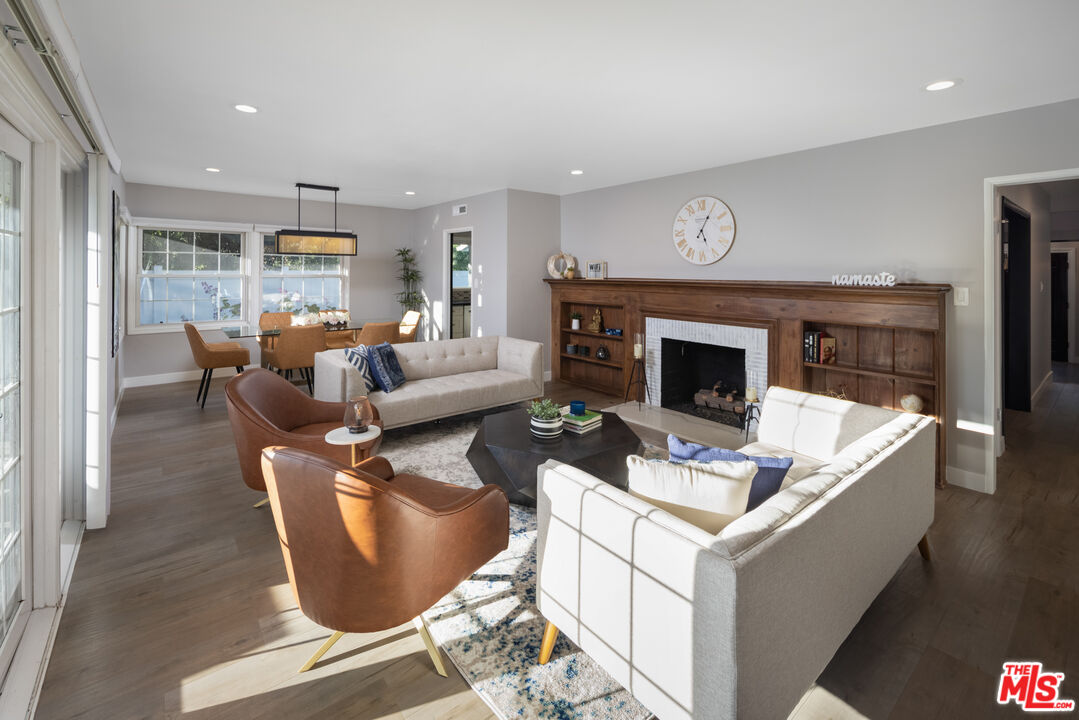 9476 Hidden Valley Place Beverly Hills, CA 90210 - Photo 39 of 43 a living room with furniture and a fireplace