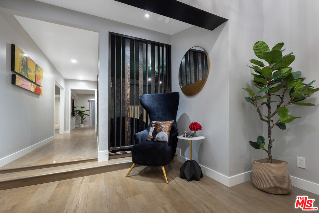 9476 Hidden Valley Place Beverly Hills, CA 90210 - Photo 41 of 43 a living room with furniture and a potted plant
