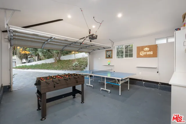 a room with furniture a table and wooden floor
