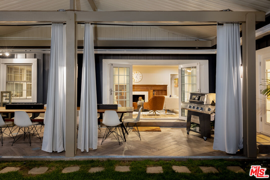 9476 Hidden Valley Place Beverly Hills, CA 90210 - Photo 8 of 43 a living room with furniture and a fireplace