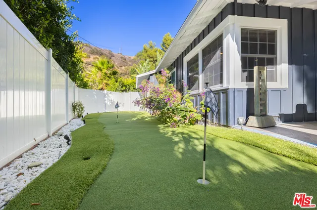 a view of a garden with a fountain