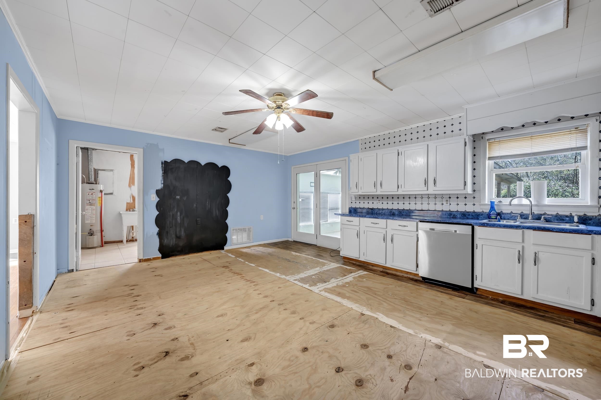 17463 Highway 98 Foley, AL 36535 - Photo 10 of 57 Kitchen featuring a ceiling fan, white cabinets, dishwasher, dark countertops, and gas water heater