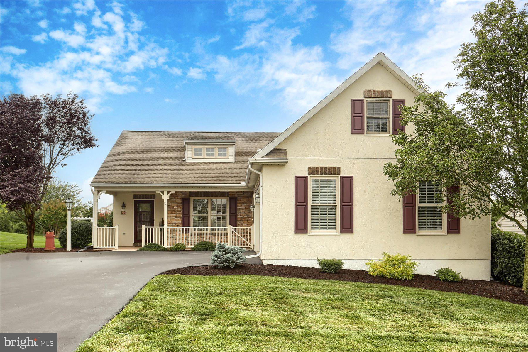 802 Heather Ridge Manheim, PA 17545 - Photo 1 of 41 a view of a yard in front of a brick house with many windows