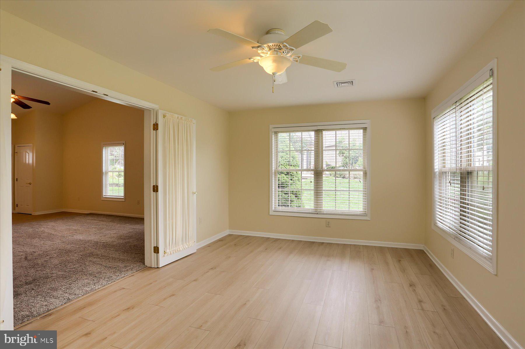 802 Heather Ridge Manheim, PA 17545 - Photo 13 of 41 a view of an empty room with a window and wooden floor