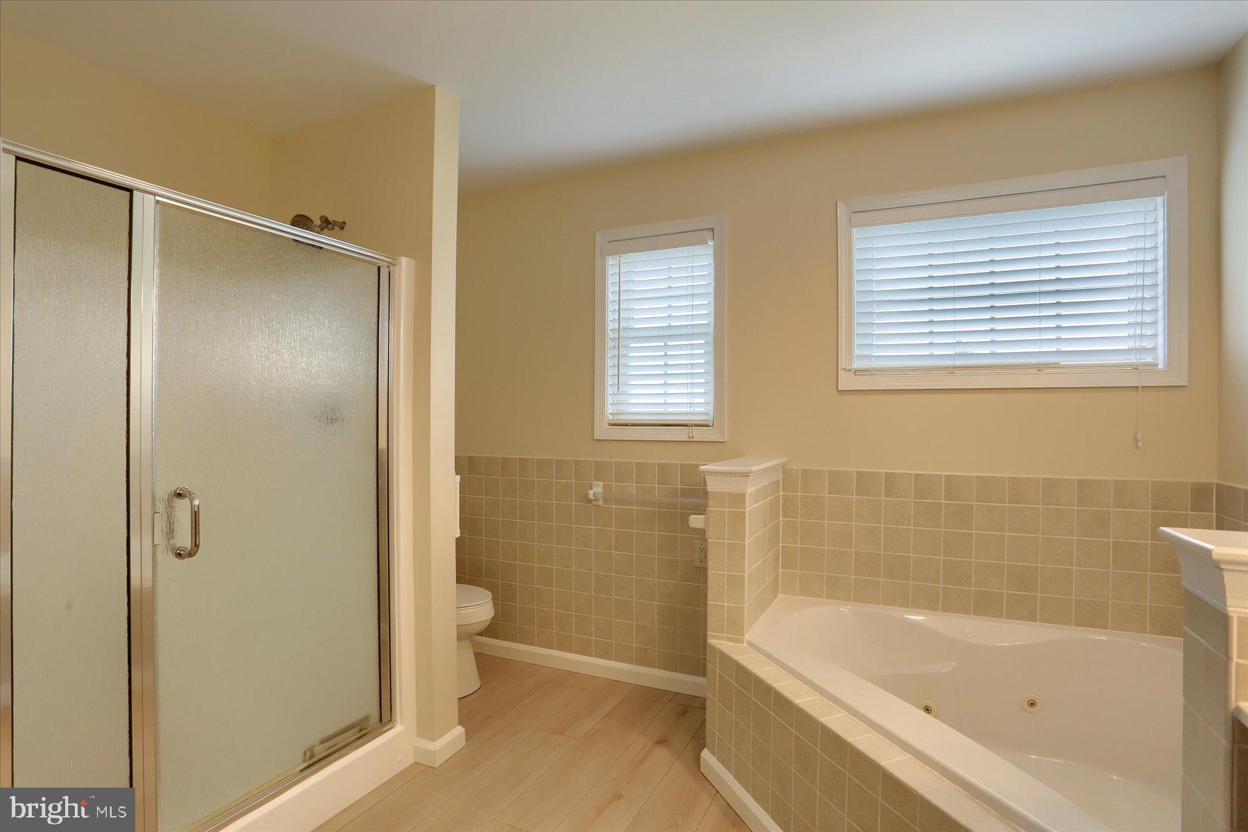 802 Heather Ridge Manheim, PA 17545 - Photo 17 of 41 a bathroom with a bathtub and a shower
