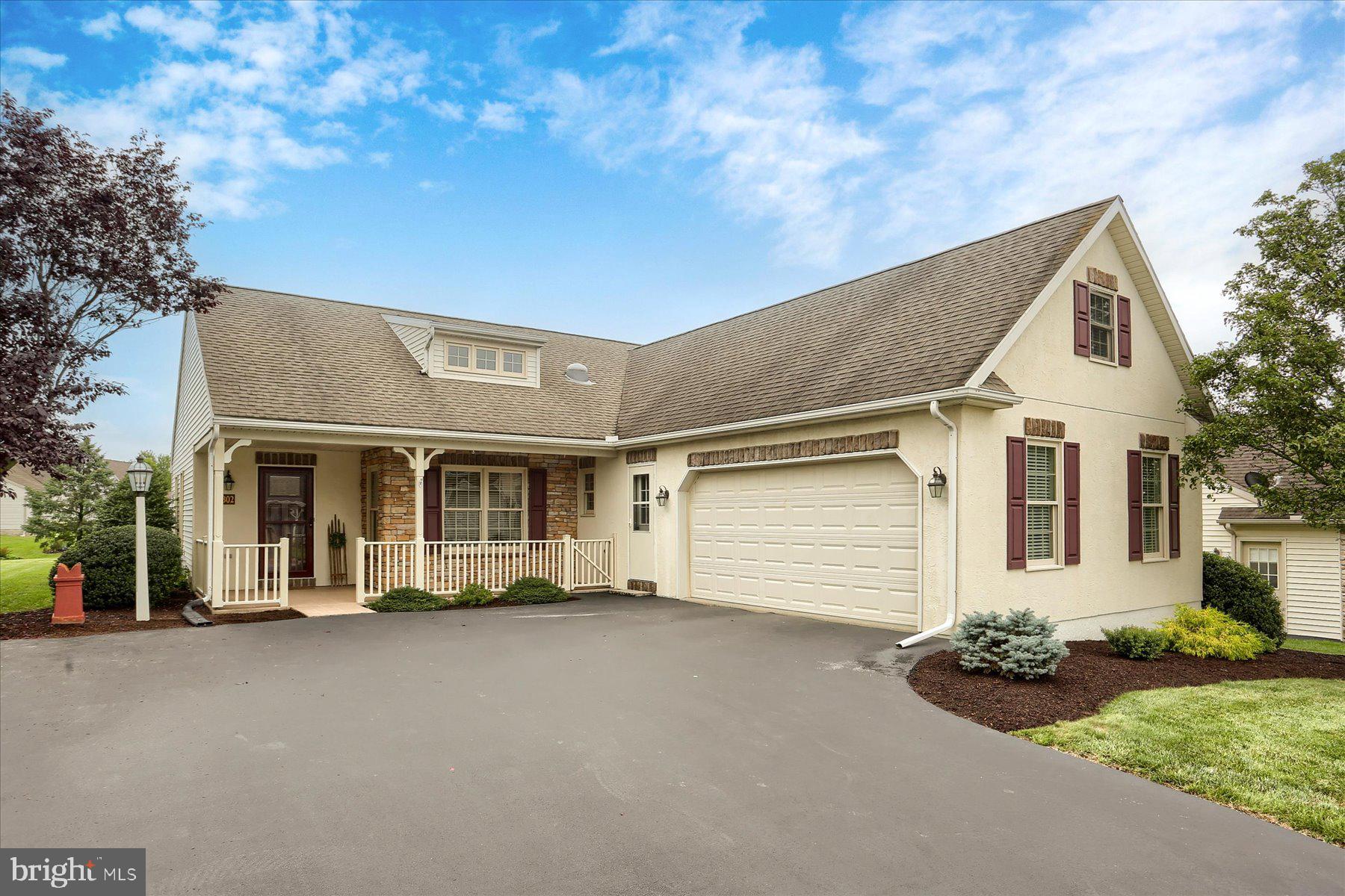 802 Heather Ridge Manheim, PA 17545 - Photo 2 of 41 a view of a white house with a yard and potted plants