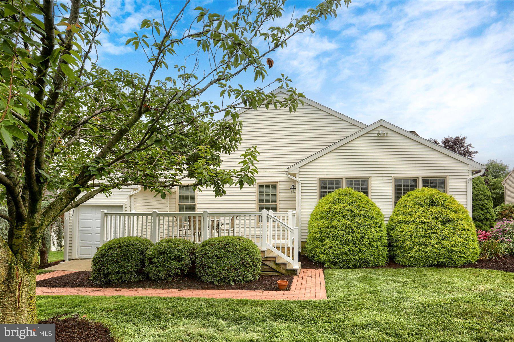 802 Heather Ridge Manheim, PA 17545 - Photo 25 of 41 a view of a yard in front of a house with plants and large tree