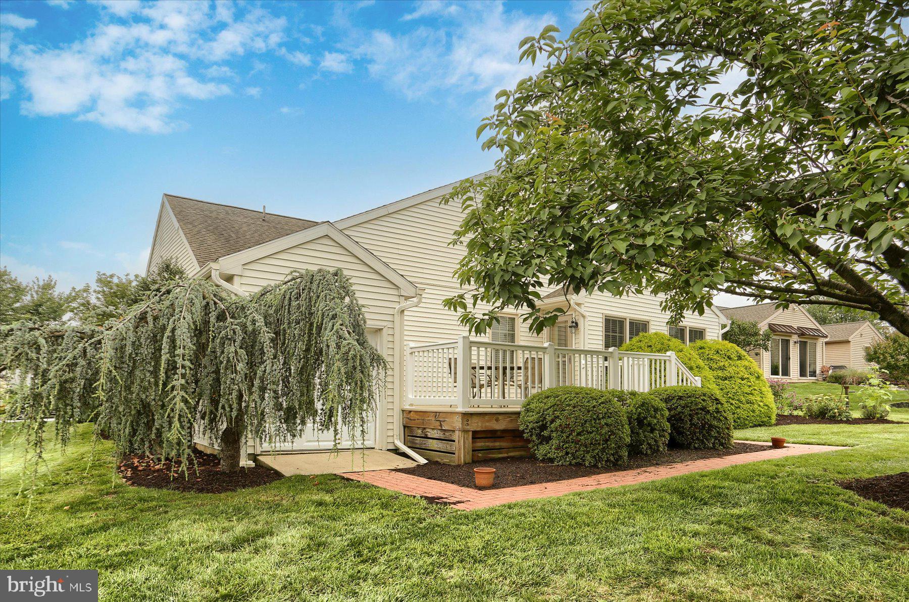 802 Heather Ridge Manheim, PA 17545 - Photo 26 of 41 a view of a white house next to a yard with big trees