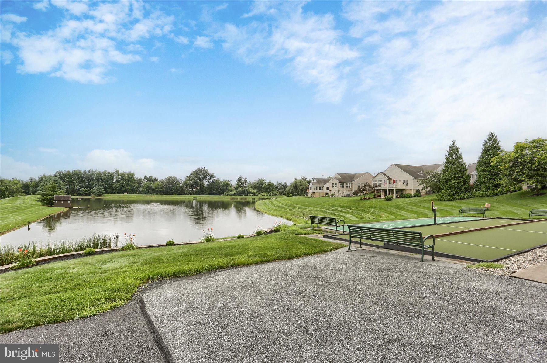 802 Heather Ridge Manheim, PA 17545 - Photo 38 of 41 a view of a lake with a yard and large trees