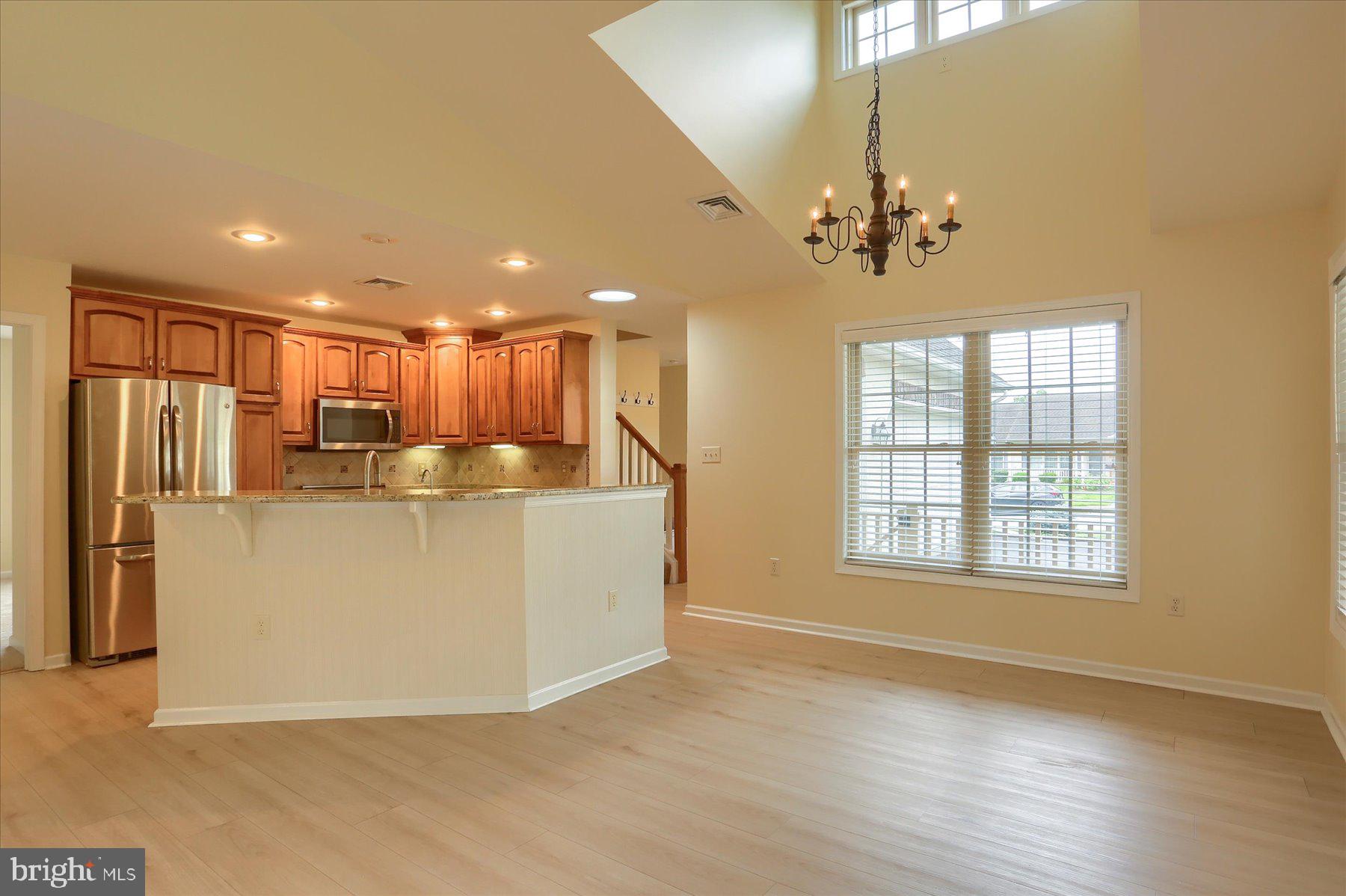802 Heather Ridge Manheim, PA 17545 - Photo 9 of 41 a view of a kitchen with refrigerator and wooden floor