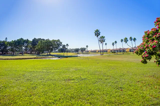 a view of a large pool and an outdoor space